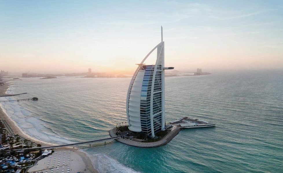 The Burj Al Arab on its artificial island off Jumeirah Beach, Dubai, at sunset