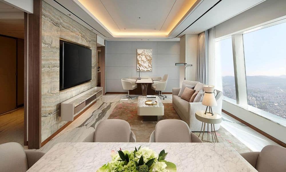 A suite at Signiel Seoul with floor-to-ceiling windows above the city