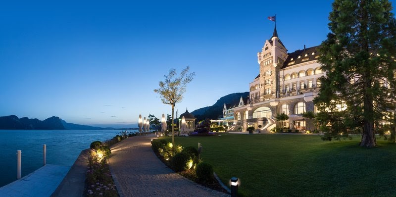 Park Hotel Vitznau and its lakeside lawn at dusk