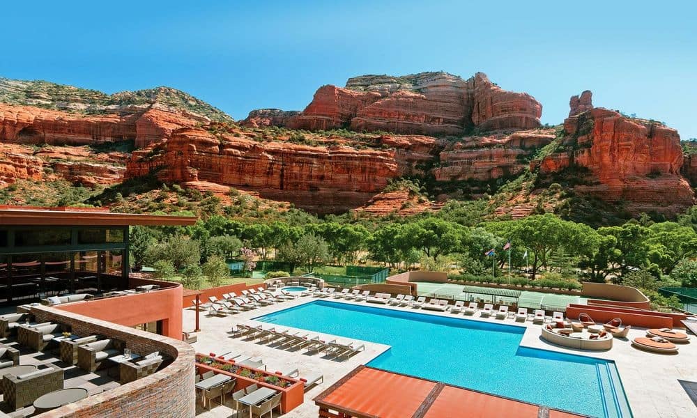 Main pool and tennis courts below the red rock walls of Boynton Canyon at Enchantment Resort, Sedona