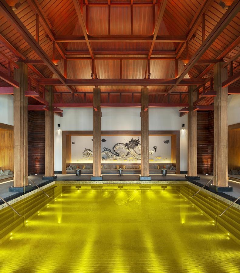 The Golden Energy Pool at The St. Regis Lhasa Resort, an indoor pool lined with gold tiles