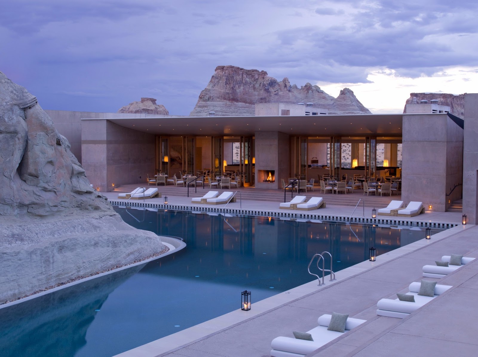 Amangiri's main pool beside the resort pavilion with sandstone cliffs behind