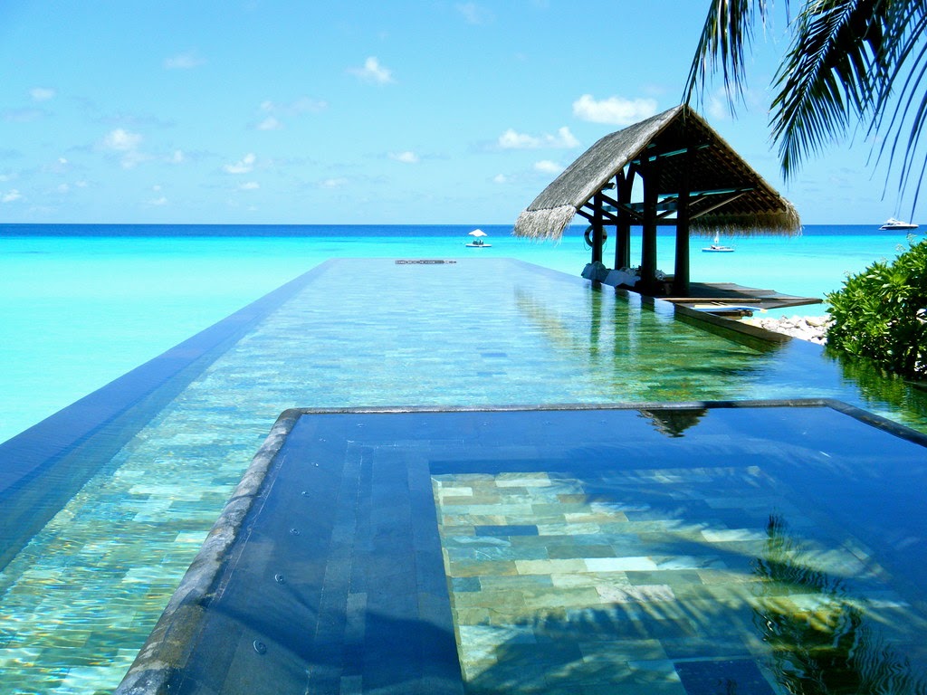 One&Only Reethi Rah's pool edge running out towards the lagoon