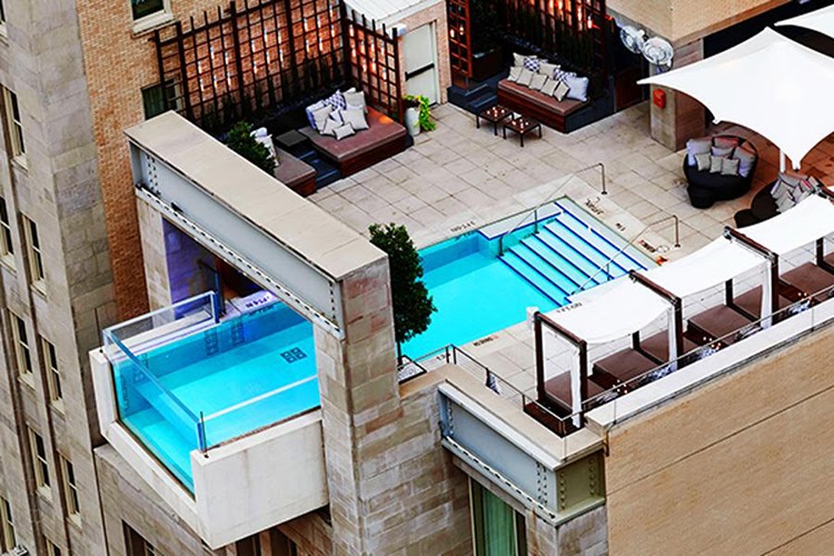 The Joule's glass-ended rooftop pool cantilevered over Main Street, Dallas