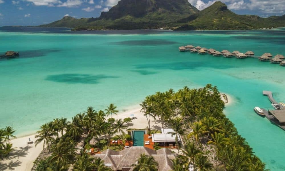 Four Seasons Resort Bora Bora overwater bungalows and beachfront villa estate with Mount Otemanu behind