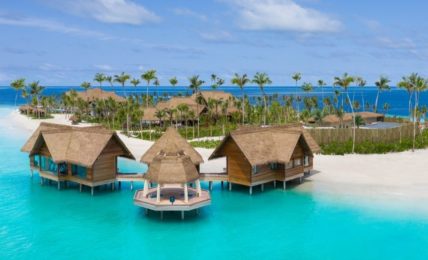 Overwater villas and beach at Waldorf Astoria Maldives Ithaafushi