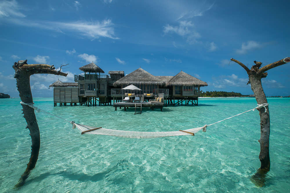 The Private Reserve overwater villa at Gili Lankanfushi, with a hammock strung over the lagoon