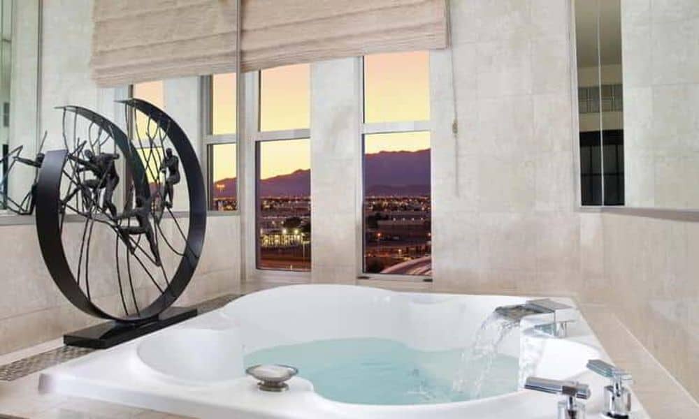 Whirlpool tub beside a window at New York-New York