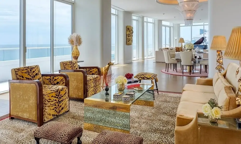 Living room of the Faena Penthouse Suite in Miami Beach, with tiger-print armchairs and ocean views