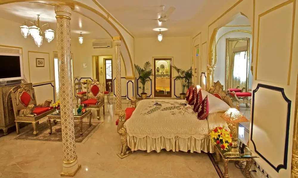 A bedroom at The Raj Palace, Jaipur