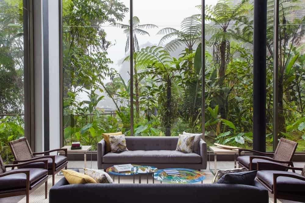 The lounge at Mashpi Lodge, with floor-to-ceiling glass facing the cloud forest
