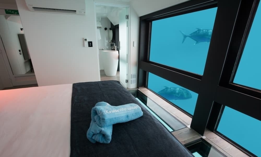 Reefsuites bedroom with floor-to-ceiling underwater windows on Hardy Reef, Great Barrier Reef