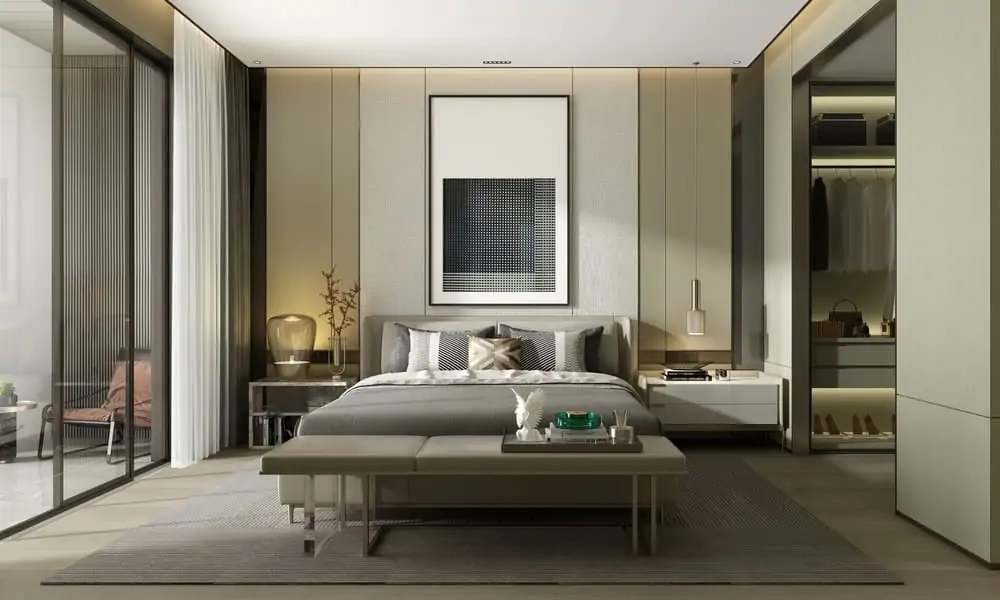 Hotel suite bedroom with a walk-in wardrobe and glass doors to a balcony